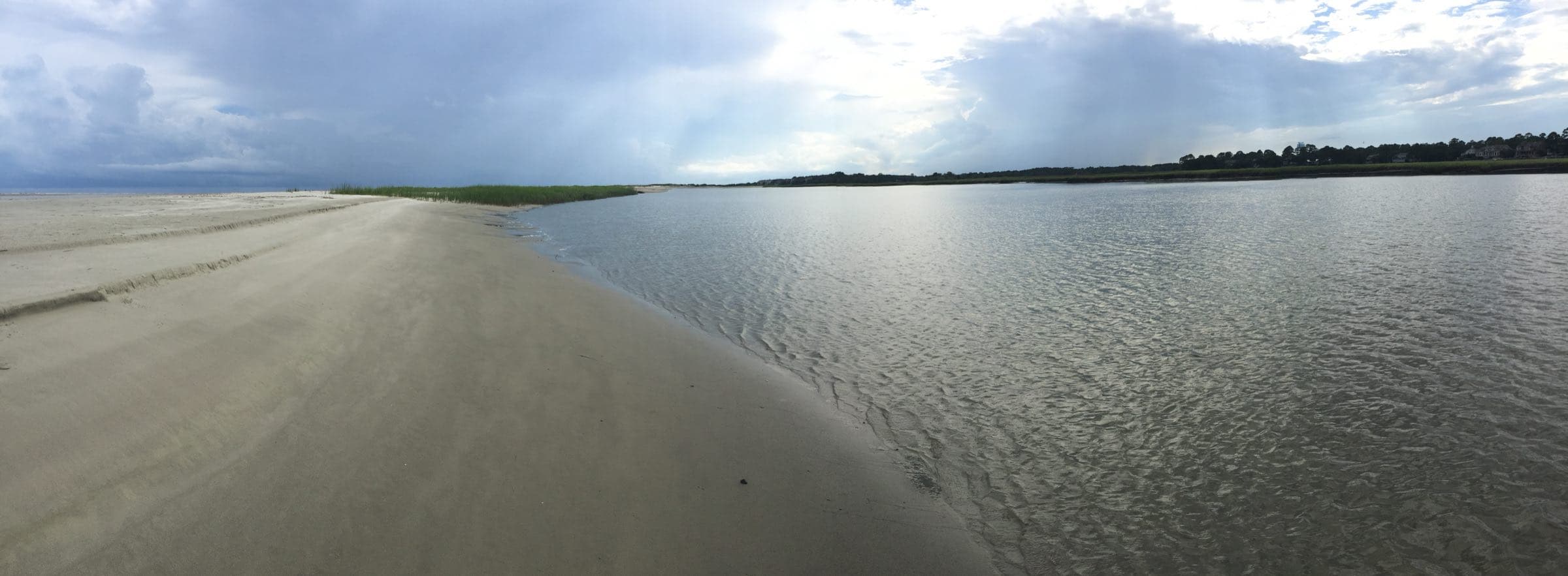 Low-tide beach and shallow water reaching to the horizon on Seabrook Island